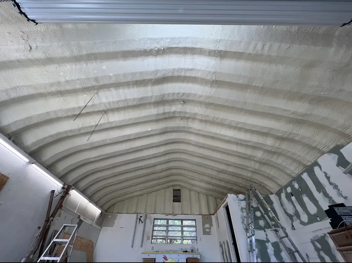 Spray polyurethane foam applied to the underside of a metal roof deck in Carmichael
